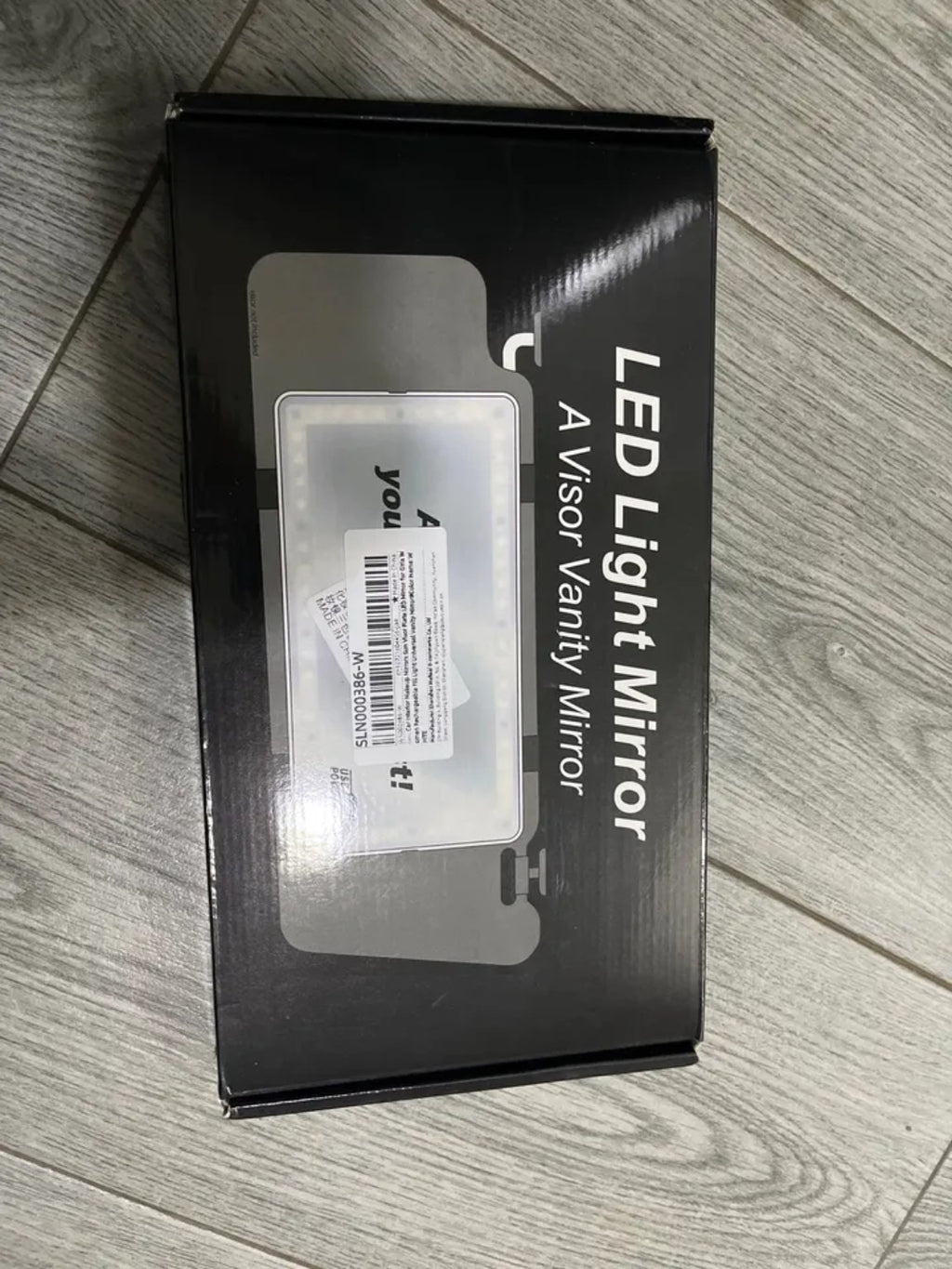 Real packaging for RivoMoto LED visor vanity mirror