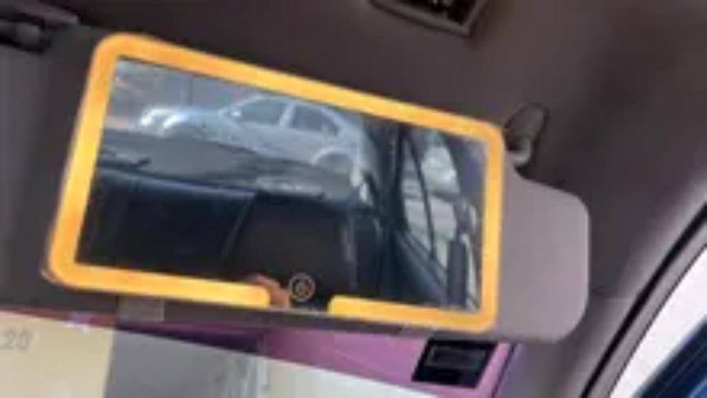Real RivoMoto visor mirror installed with warm LED light