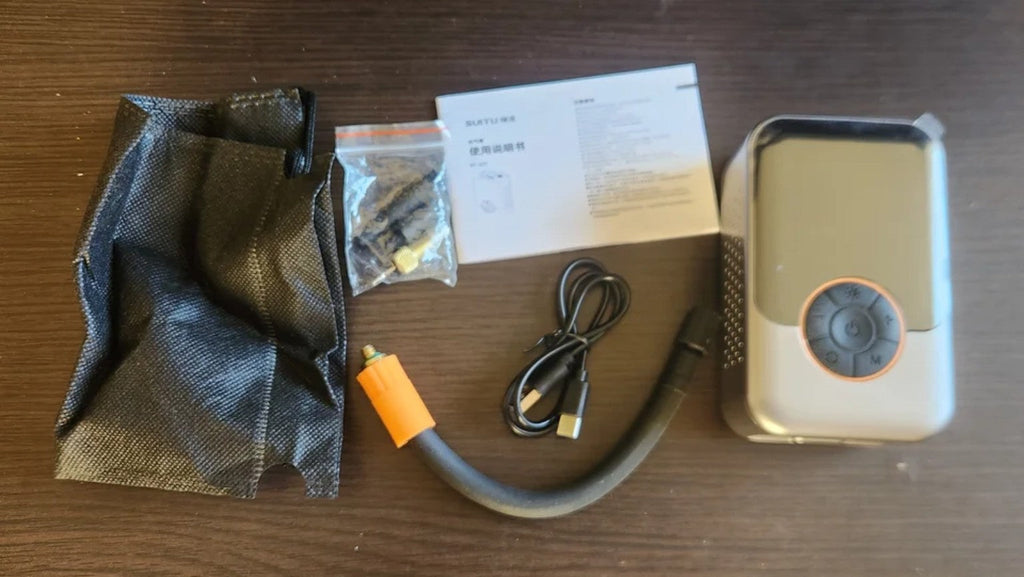 Fotografía real del inflador portátil y accesorios – 107135